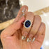Blue oval cut sapphire engagement ring close-up
