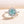 Load image into Gallery viewer, Louily Snowflake Design Halo Round Cyan Blue Moissanite Stone Engagement Ring In Sterling Silver
